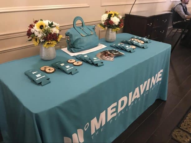 The Mediavine raffle table, displaying the teal camera bag.