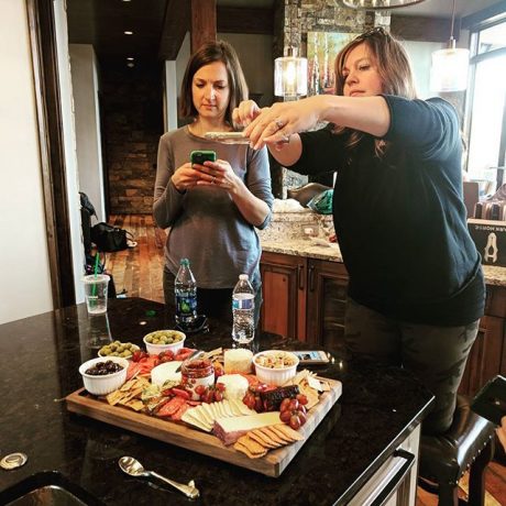 Photo-ception: A photo of Breck Blog Retreat attendees taking photos of food.