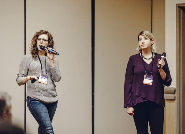 Stephie Predmore and Jenny Guy speaking at the Outdoor Blogger Summit.