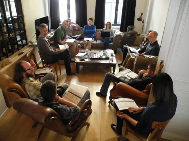 The Agathon team meeting in a more casual living room type setting.