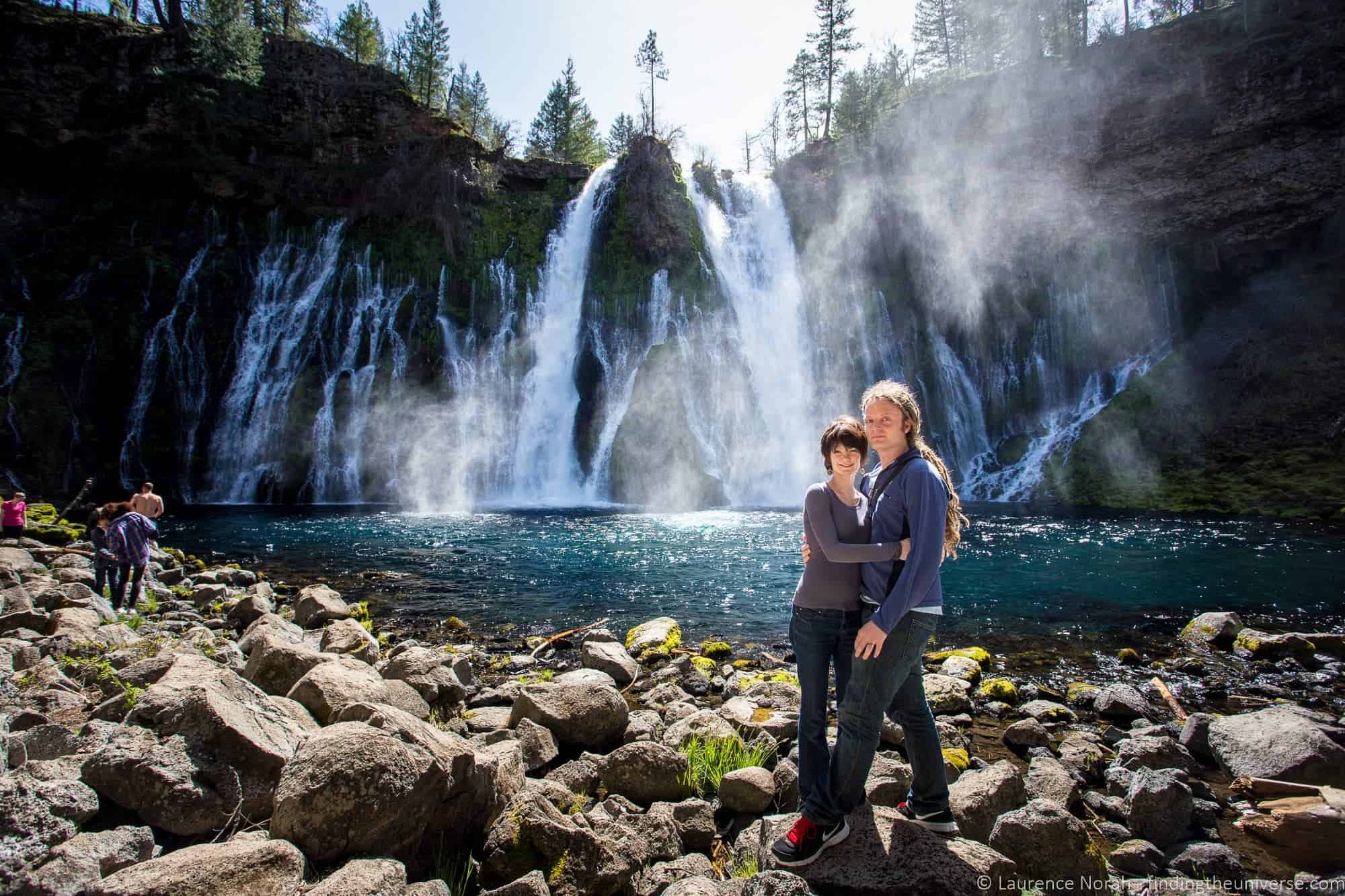 Lauraence Norah and his wife, Jessica, stand in front of a waterfall.