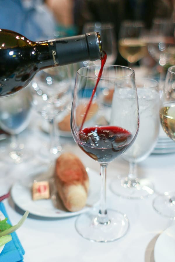 Wine being poured into a glass.