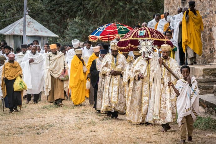 Men gather outside a church in Axum, Ethiopia for a religious ceremony.
