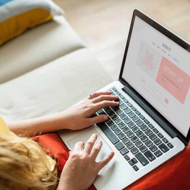 person using trackpad and keyboard on a laptop