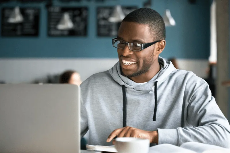 A man using a laptop computer.