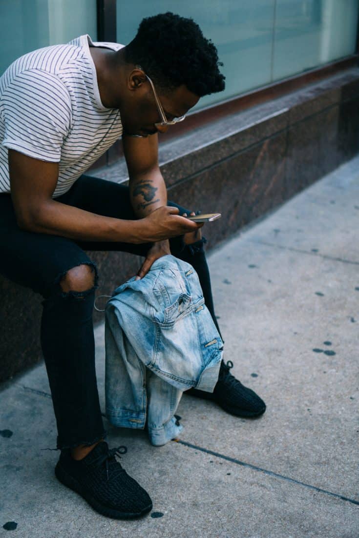 A man using a smart phone.