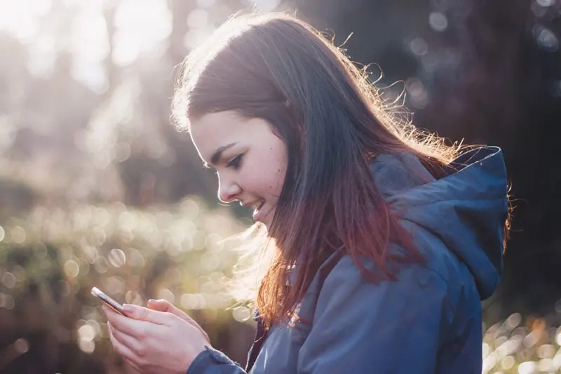 A woman using a smart phone.