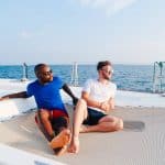 yaya and lloyd sitting on a boat