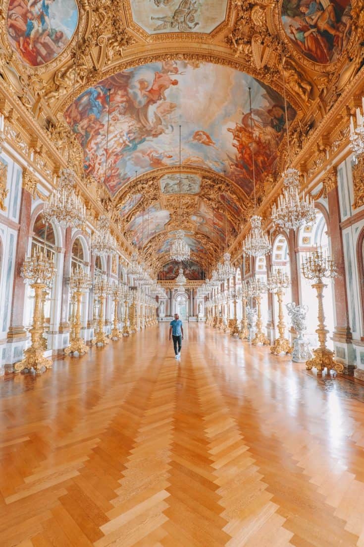 Yaya walking through the halls of Herrenchiemsee Palace in Germany.