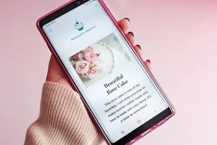 A smart phone displaying a recipe card for a Beautiful Rose Cake.