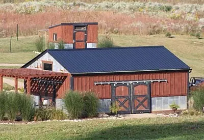 A red and navy painted barn.