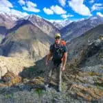 Matthew standing with mountains in the background