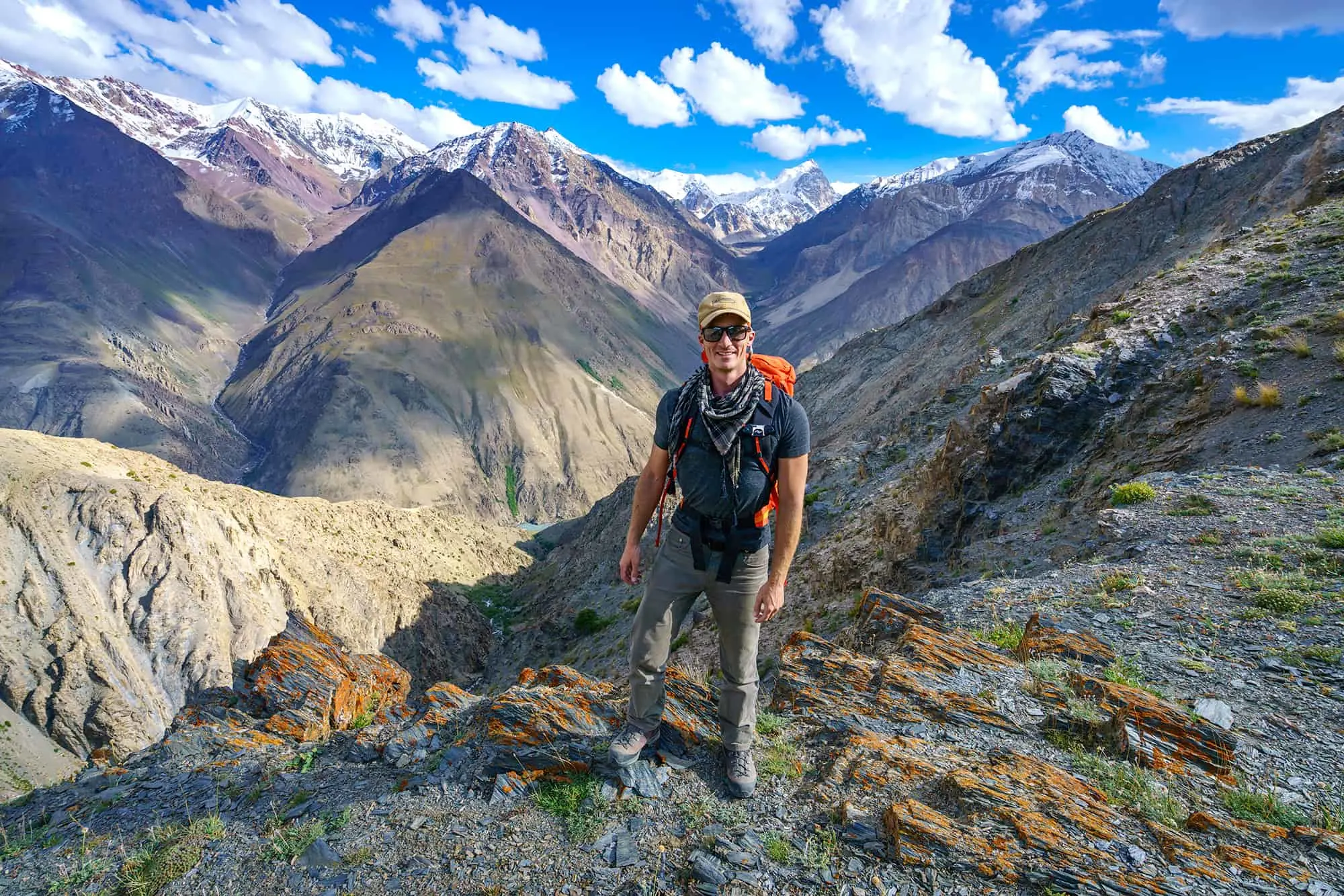 Matthew standing with mountains in the background