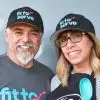 Hilda and partner wearing fit to serve shirts and hats