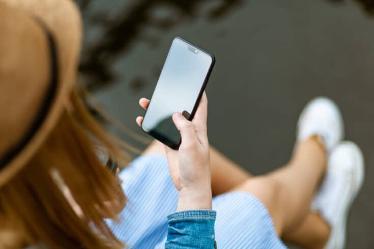 A woman using a smart phone.