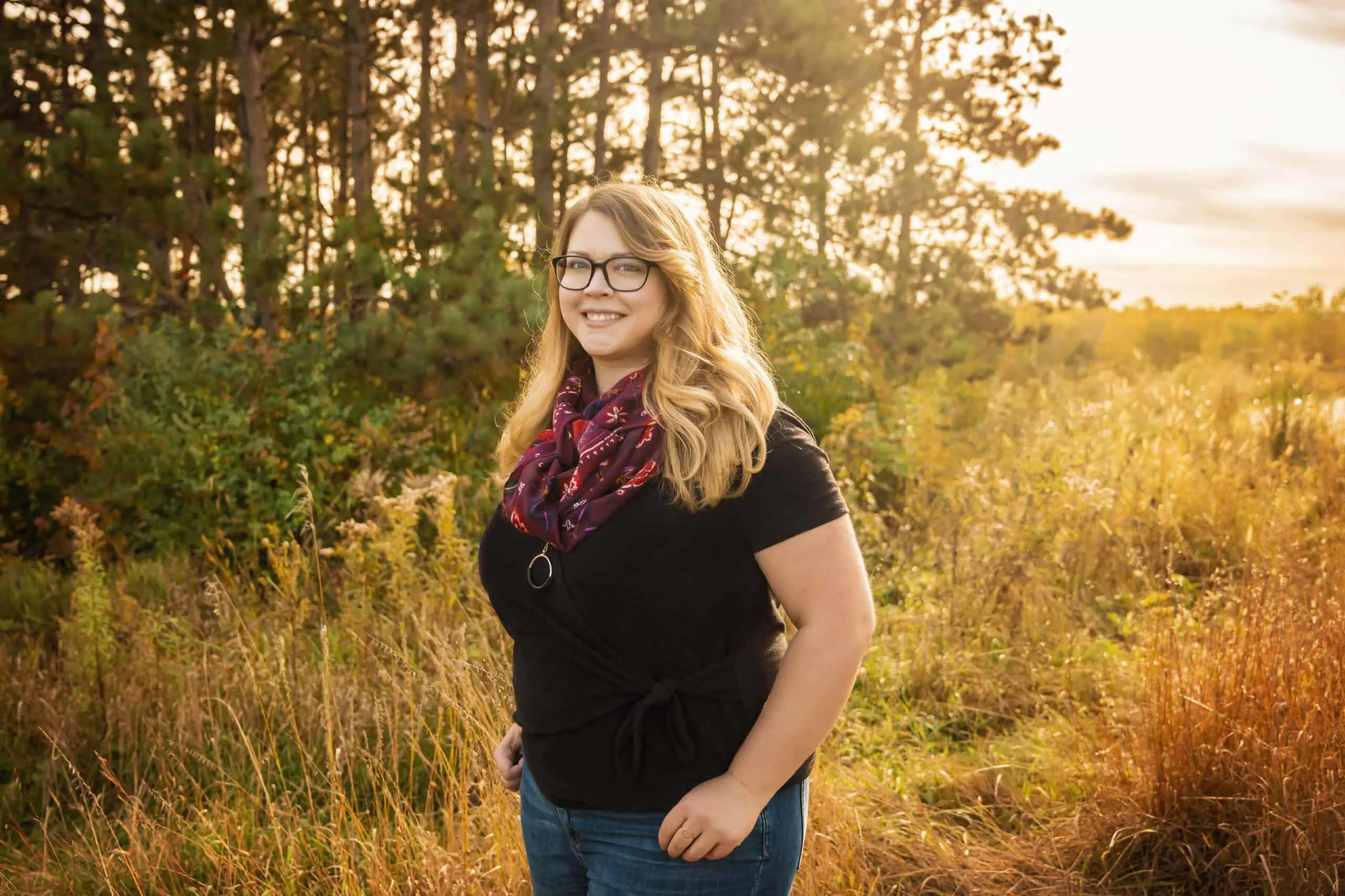 trista standing in a grass field