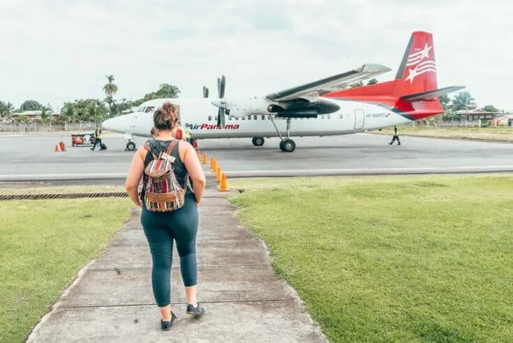Lia Garcia walks towards an AirPanama airplane.