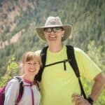 John and wife standing together outside