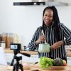 food blogger cooking in front of camera