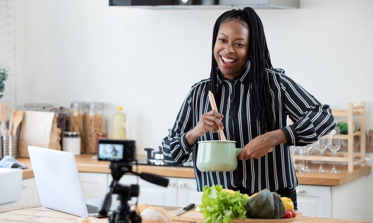 food blogger cooking in front of camera