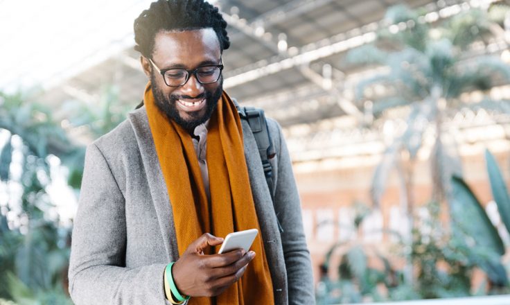 man using a smartphone outside