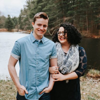 palmer zona mundt and husband posing by a lake