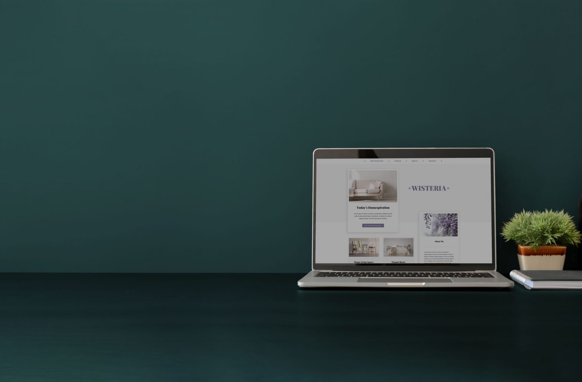 computer on a desk in a green room showing a mediavine trellis theme