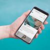 hand holding phone with mediavine website