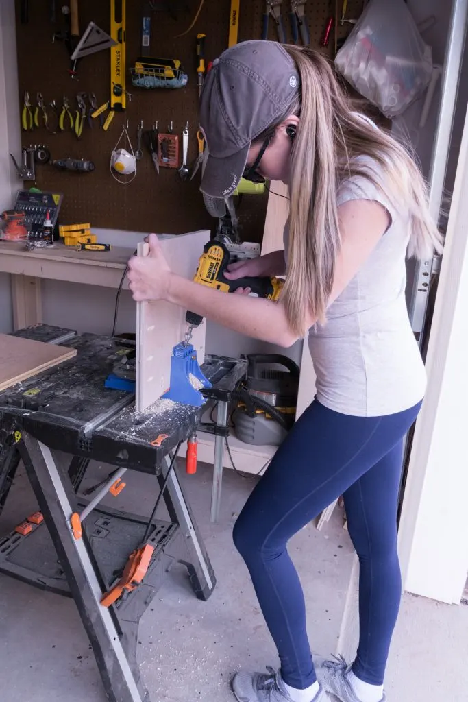 Brittany Goldwyn using power tools at a workbench for a diy.