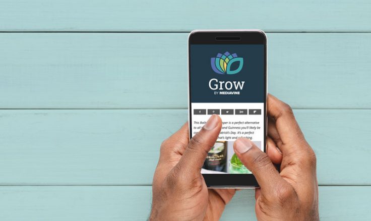 hands holding phone with grow logo and social icons