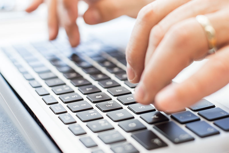 closeup of fingers typing