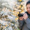 woman photographing in the snow