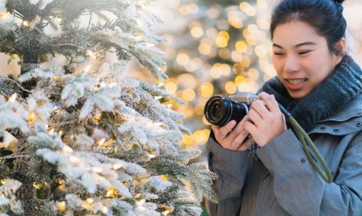 woman photographing in the snow