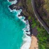 aerial view of ocean and winding road