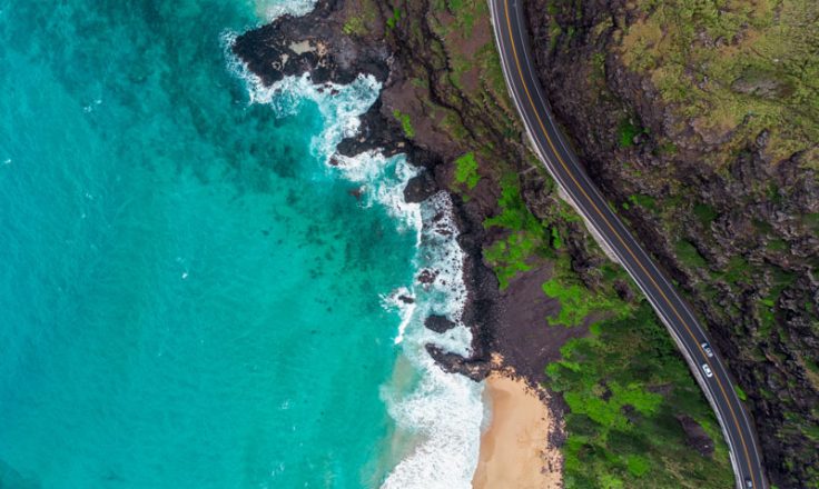 aerial view of ocean and winding road