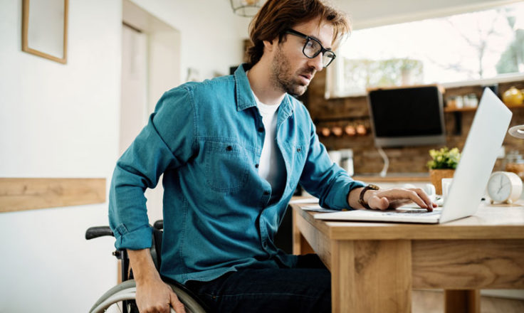 man using laptop at desk