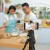 two people recording a cooking video