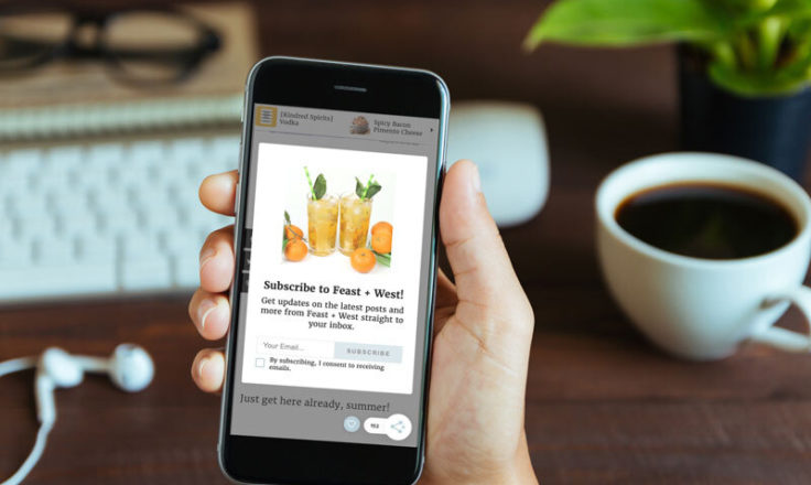 grow.me's subscribe feature shown on a phone someone us using at a desk