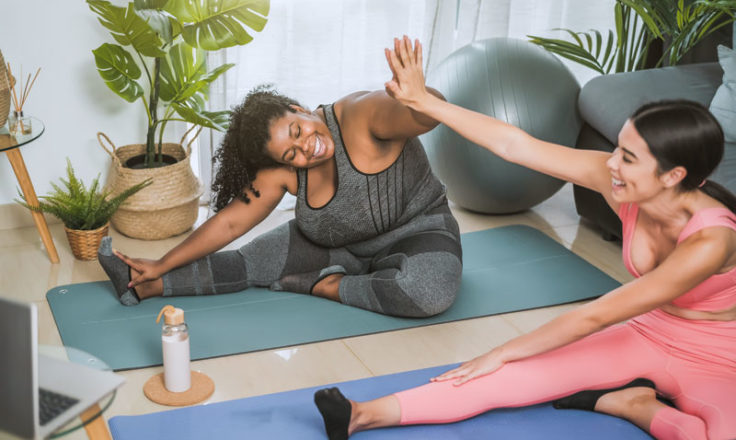 two people doing yoga