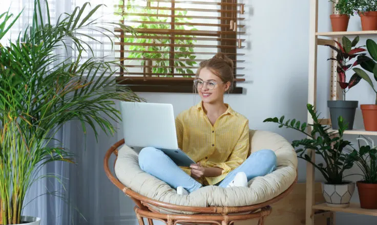 Girl Sitting in Chair on Computer