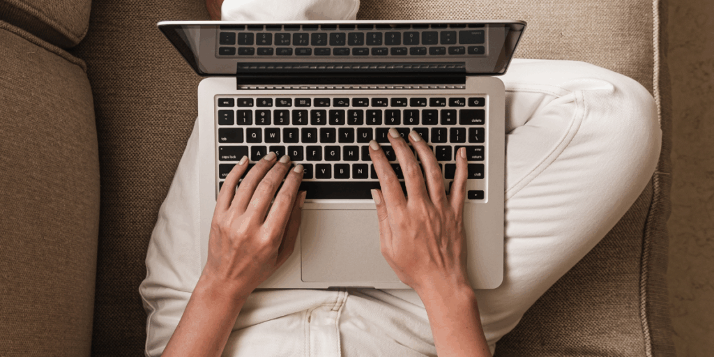 Woman typing at keyboard